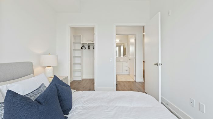 blue textile on white bed